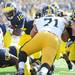 Michigan quarterback Devin Gardner looks to carry the ball into the end zone against Iowa during the first quarter at Michigan Stadium. Melanie Maxwell I AnnArbor.com